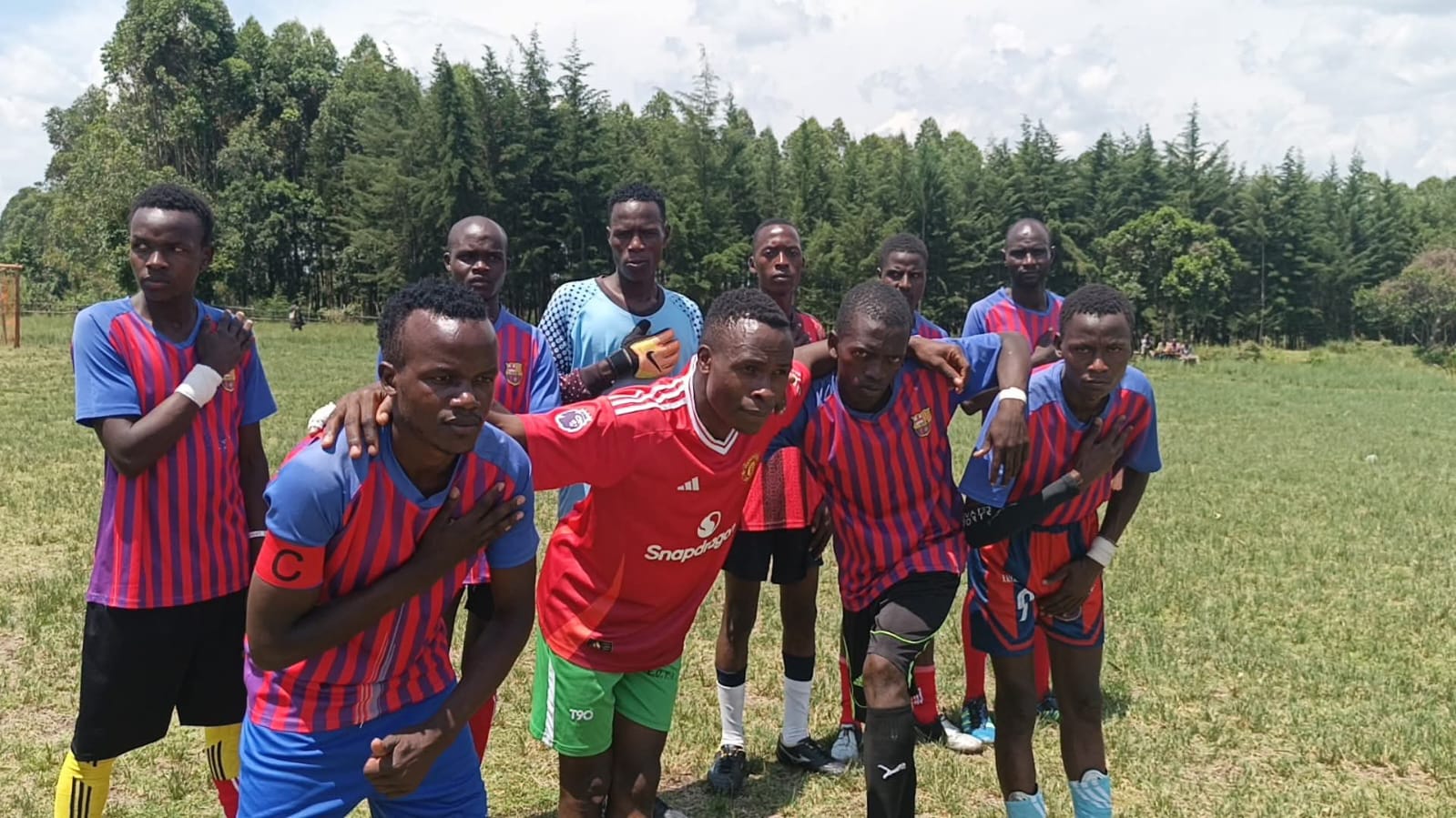 Players pose for a group photo after the match. PHOTO/Geoffrey Kimagut