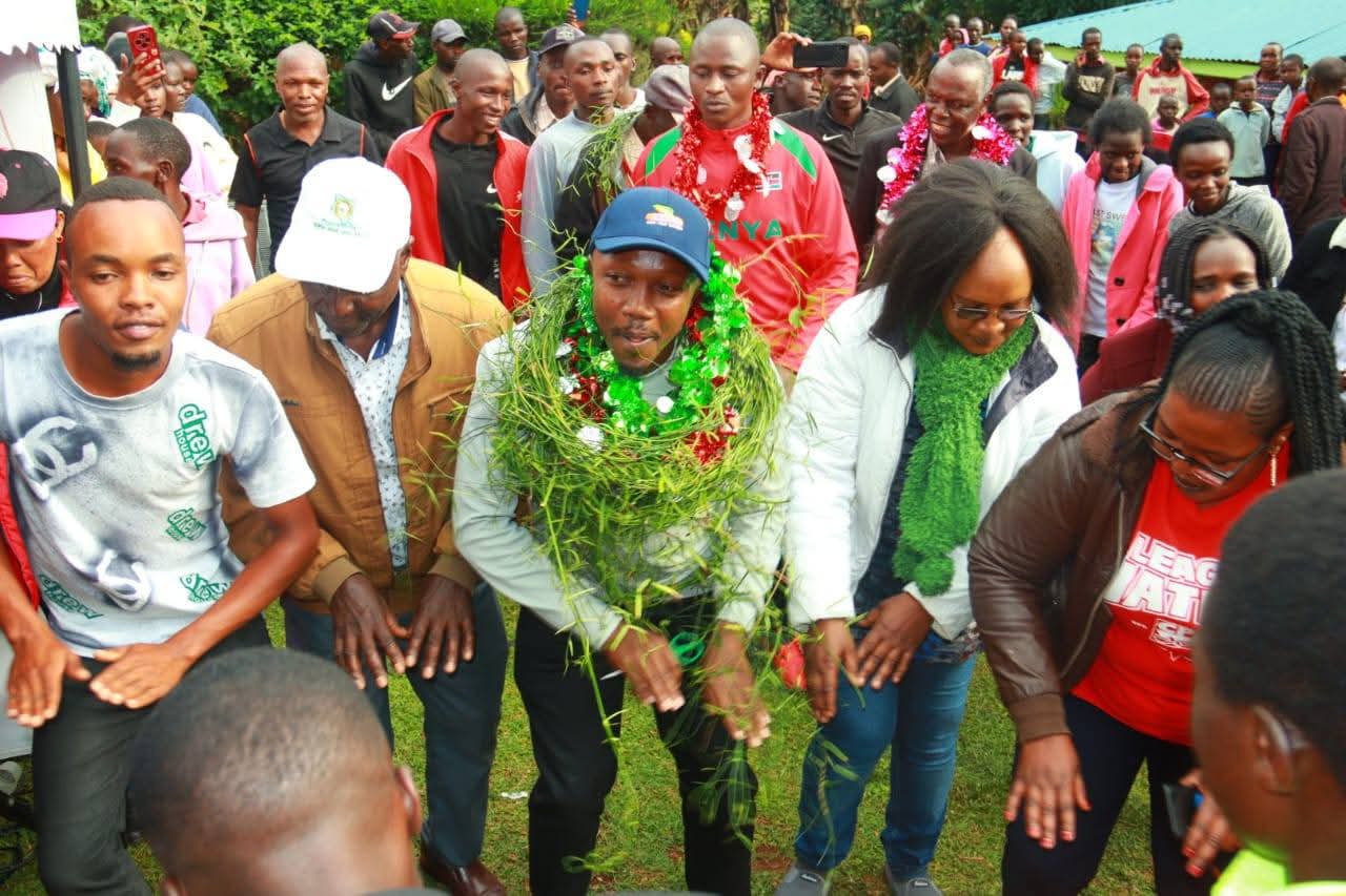 Lawyer Bernhard Ngetich(centre) joins a dance  at Kenegut, Kapsoit Ward in Kericho county moments after urging for a united fight against doping in Kenyan sports. PHOTO/Geoffrey Kimagut
