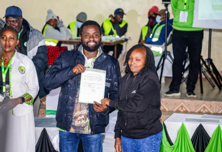 Ol Kalou MP-elect Sammy Kamau Ngotho and his wife display the IEBC certificate after being declared the winner in the Ol Kalou by-election. PHOTO/https://web.facebook.com/kamausammyngotho