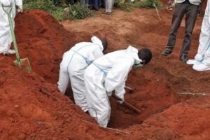 Workers dig up a grave in Shakahola forest in Malindi in 2023. PHOTO/@InteriorKE/X